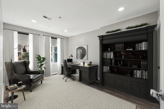 home office with wood finished floors, visible vents, and recessed lighting