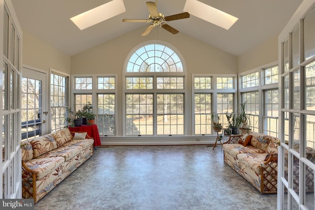 sunroom with ceiling fan, vaulted ceiling with skylight, french doors, and plenty of natural light