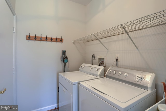 washroom with laundry area and washing machine and dryer