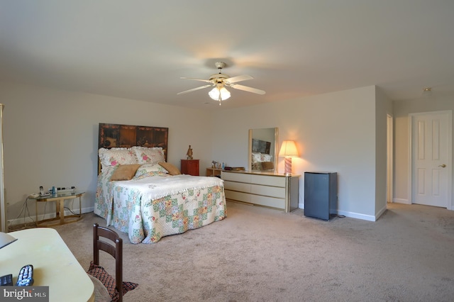 bedroom with carpet floors, baseboards, and a ceiling fan