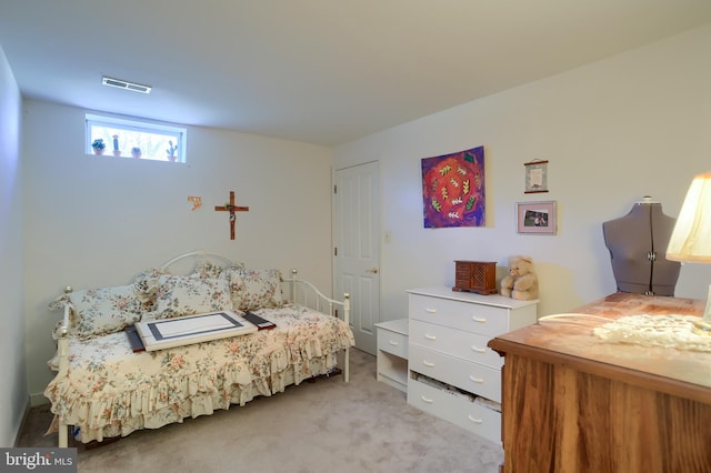 bedroom featuring carpet and visible vents