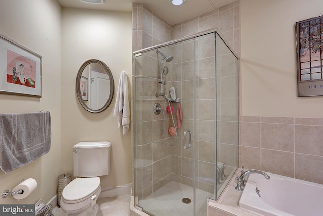 full bathroom featuring toilet, baseboards, a shower stall, a bath, and tile patterned floors