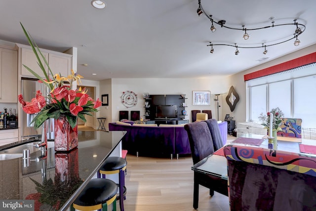 dining space with recessed lighting, visible vents, light wood-style flooring, and rail lighting