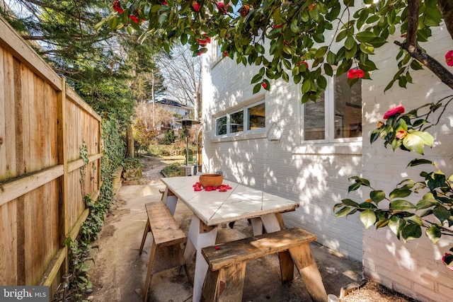 view of patio / terrace with outdoor dining area and fence