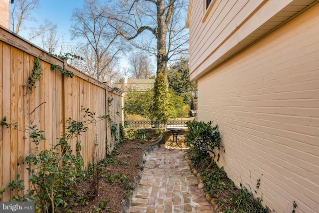 view of home's exterior featuring fence