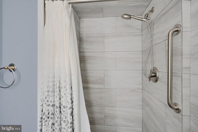 full bathroom with a tile shower