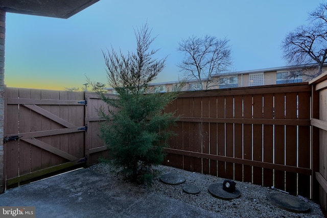 view of gate featuring fence