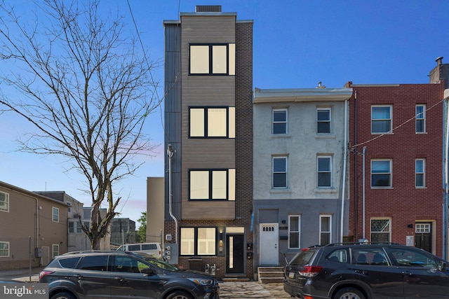 view of front of property featuring brick siding