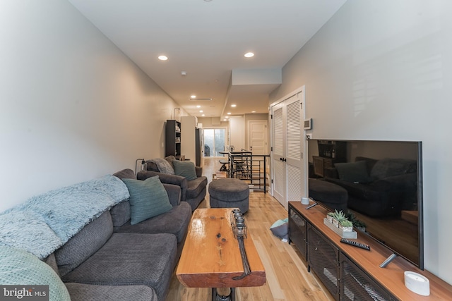 living room featuring light wood-type flooring and recessed lighting