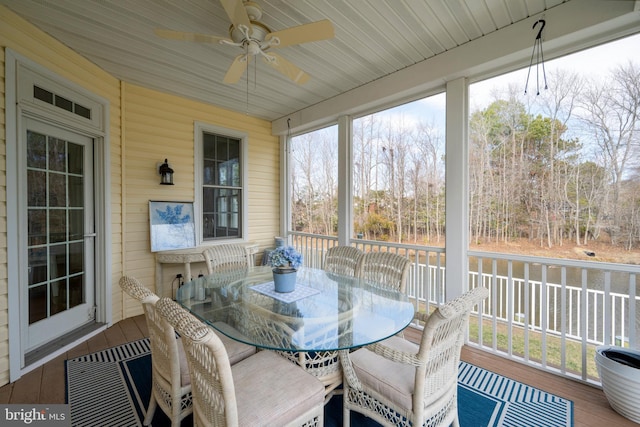 sunroom with a ceiling fan