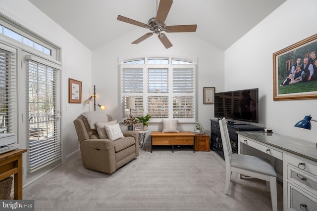 office space featuring light colored carpet, vaulted ceiling, and ceiling fan