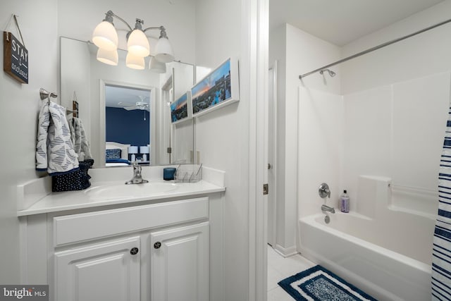 ensuite bathroom featuring tile patterned flooring, vanity, ensuite bathroom, and shower / bath combo with shower curtain