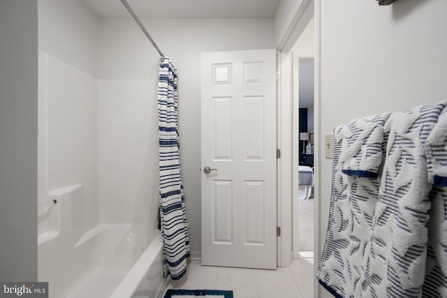 bathroom featuring tile patterned flooring and shower / bathtub combination with curtain