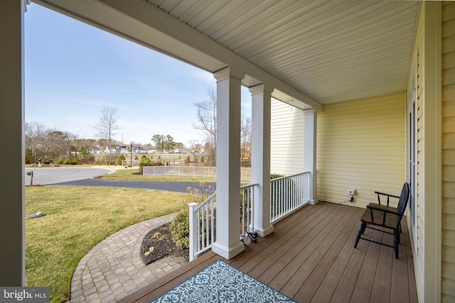 9 Lake Village Cir, Ocean View, DE 19970 - wooden deck featuring a porch and a lawn