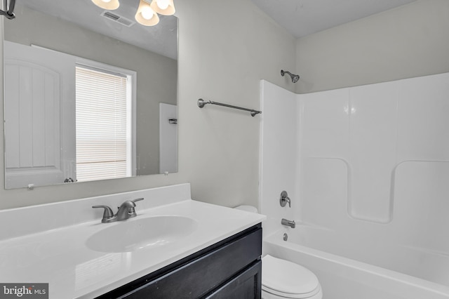 bathroom featuring vanity, toilet, bathtub / shower combination, and visible vents