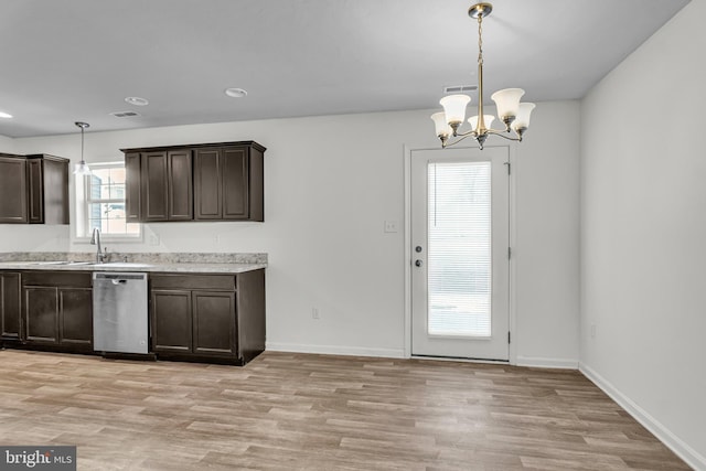 kitchen featuring dishwasher, light countertops, dark brown cabinets, and light wood-type flooring