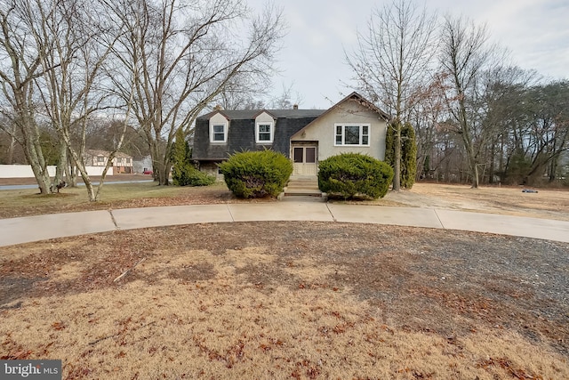 view of front of property with a shingled roof