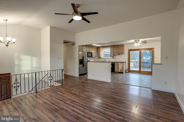 unfurnished living room with baseboards, dark wood finished floors, vaulted ceiling, a sink, and ceiling fan with notable chandelier