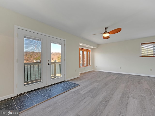 entryway with wood finished floors, french doors, baseboards, and ceiling fan