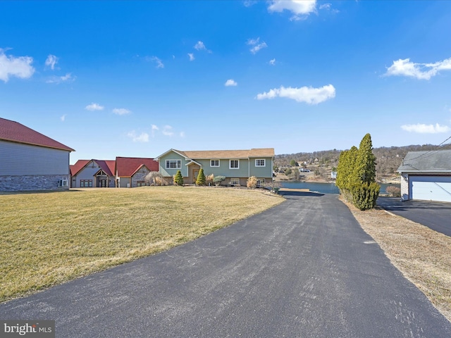 view of front of house with a residential view and a front yard