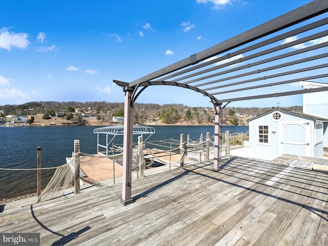 dock area featuring a pergola and a water view