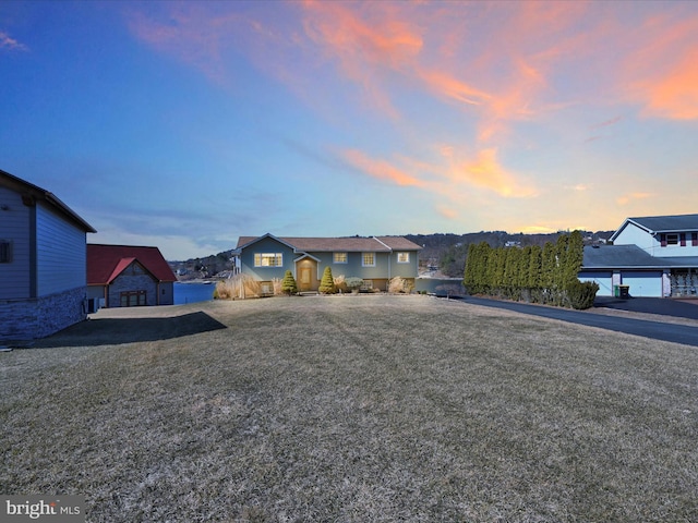 ranch-style house featuring a yard