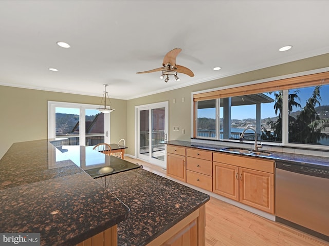 kitchen featuring light wood finished floors, light brown cabinets, dishwasher, ornamental molding, and a sink