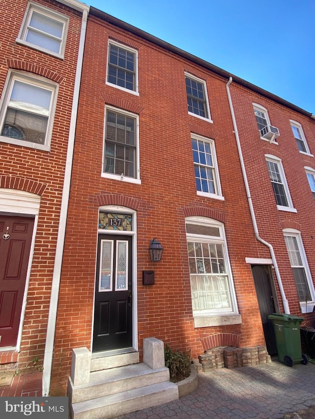 view of front of property featuring brick siding