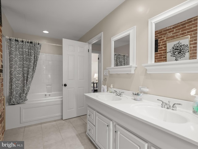 bathroom featuring double vanity, shower / bath combination with curtain, a sink, and tile patterned floors