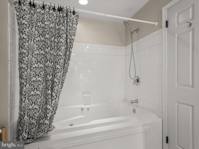 bathroom with shower / bathtub combination with curtain