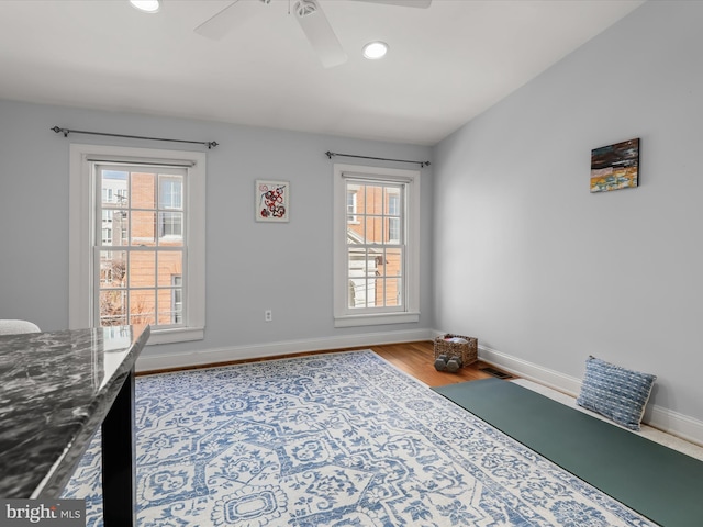 office area featuring baseboards, wood finished floors, and recessed lighting