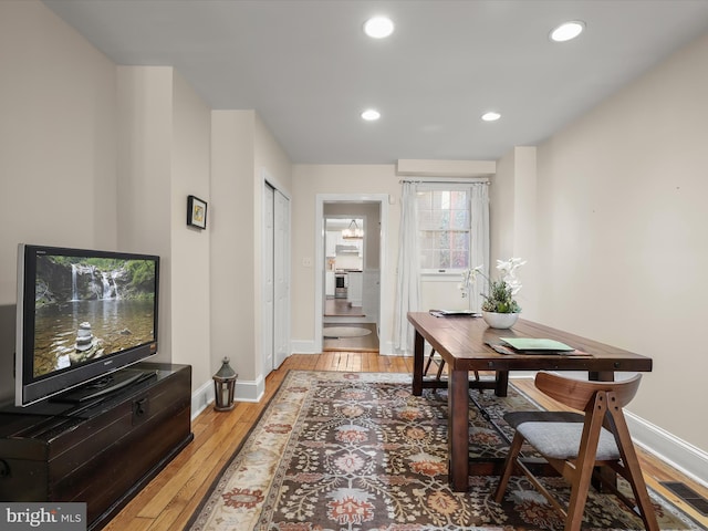 office with light wood finished floors, baseboards, visible vents, and recessed lighting