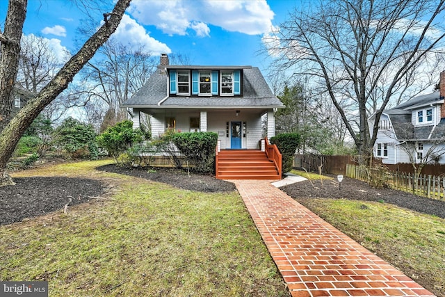 bungalow-style house featuring a porch, fence, a front yard, a shingled roof, and a chimney