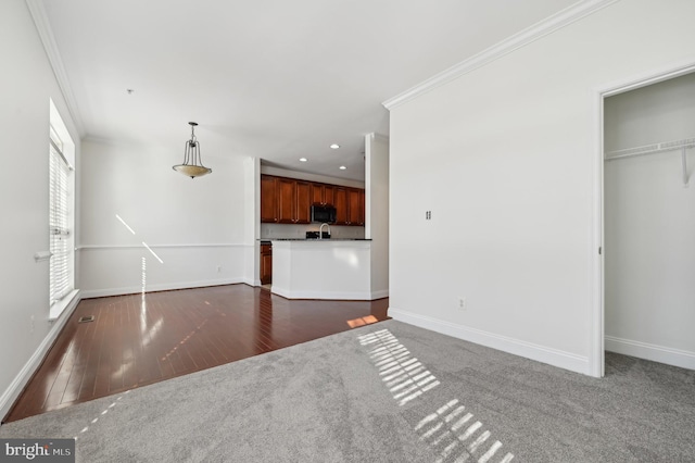 unfurnished living room with ornamental molding, recessed lighting, baseboards, and dark wood-style floors