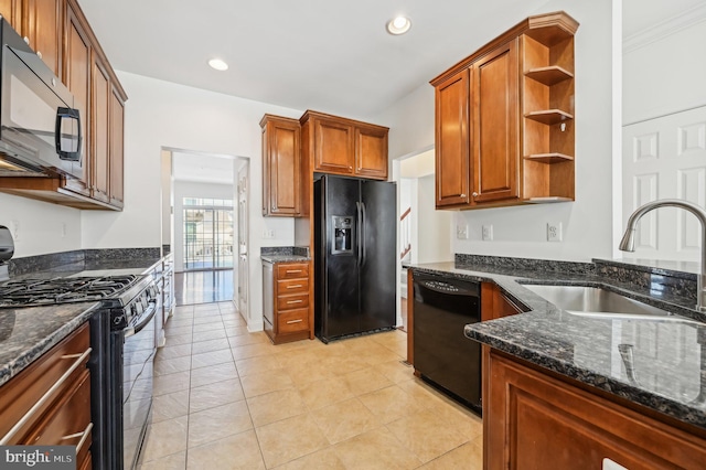 kitchen featuring a sink, black appliances, brown cabinets, dark stone counters, and open shelves