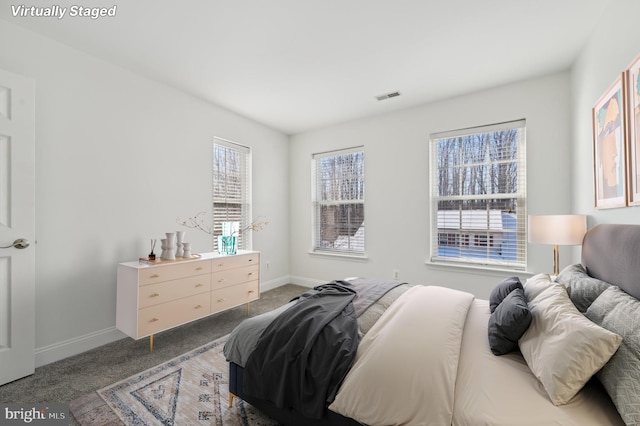 bedroom featuring carpet, visible vents, and baseboards