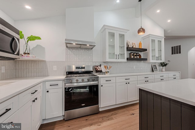 kitchen featuring open shelves, stainless steel appliances, visible vents, light wood-style flooring, and white cabinets