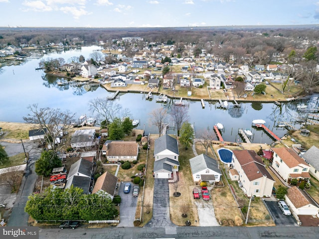 birds eye view of property featuring a residential view and a water view