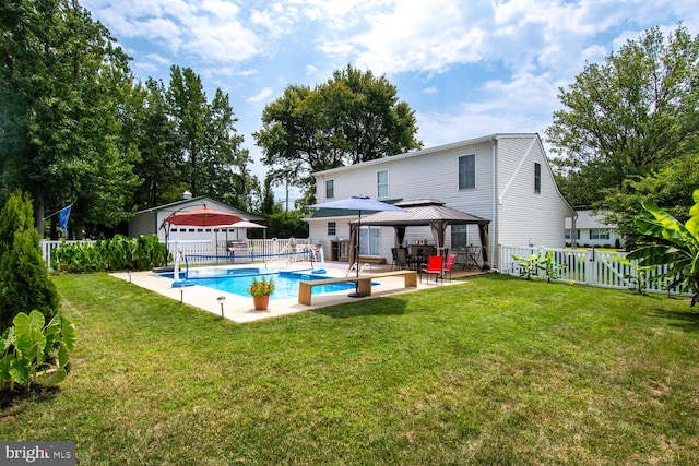 back of property with a patio, a fenced backyard, a gazebo, a lawn, and a fenced in pool