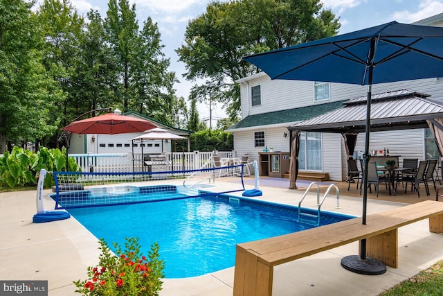 view of pool featuring a fenced in pool, an outbuilding, fence, a gazebo, and a patio area