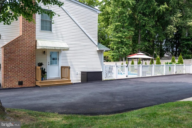 view of home's exterior featuring fence