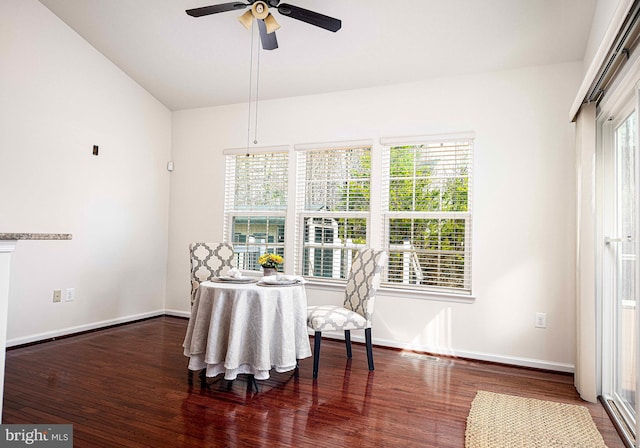 living area featuring ceiling fan, baseboards, and wood finished floors