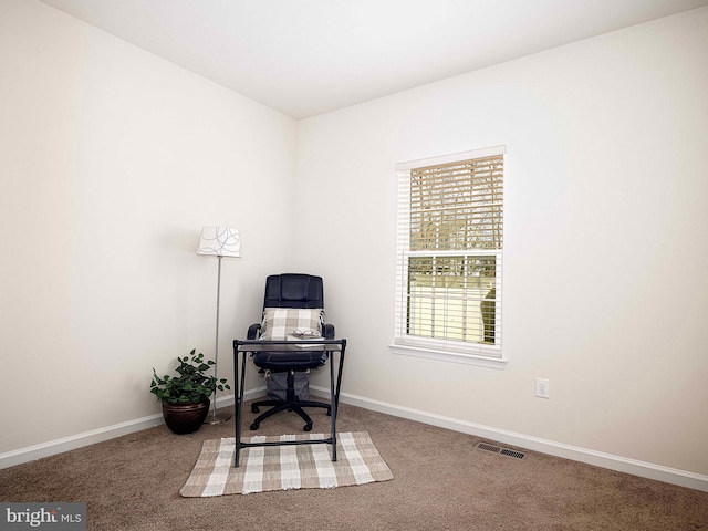 carpeted home office featuring baseboards and visible vents