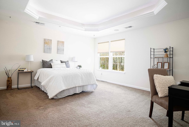 bedroom featuring a raised ceiling, baseboards, visible vents, and carpet floors