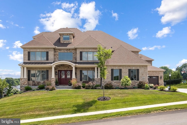 view of front facade with an attached garage, brick siding, roof with shingles, and a front yard