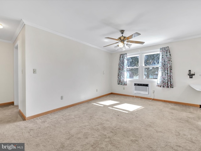 carpeted spare room featuring ornamental molding, a wall mounted AC, a ceiling fan, and baseboards