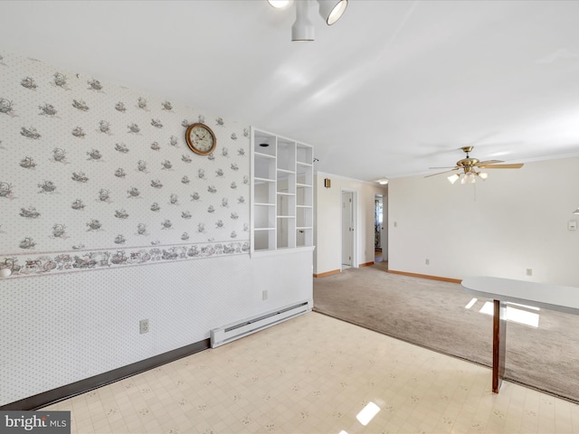 spare room with a baseboard radiator, tile patterned floors, and wallpapered walls