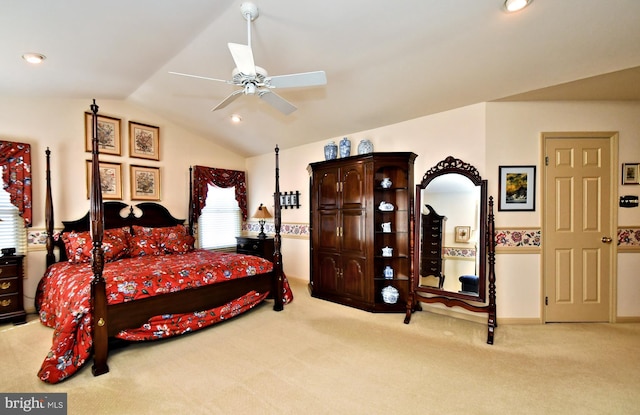 bedroom with ceiling fan, recessed lighting, vaulted ceiling, and light colored carpet