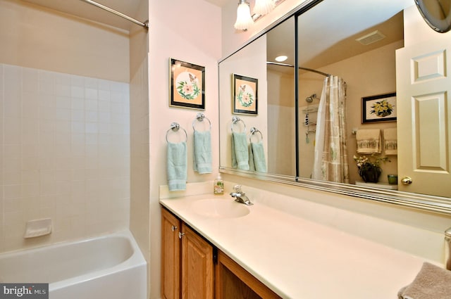 full bath with visible vents, shower / tub combo with curtain, and vanity