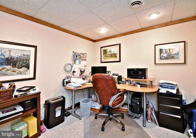 home office with carpet floors, a paneled ceiling, and visible vents